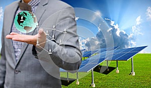 Solar farm with businessman carry virtual world