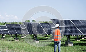The solar farm(solar panel) with engineers check the operation of the system.