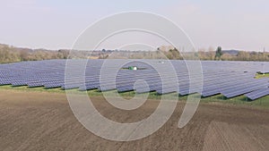 A Solar Farm and Traditional Farming Side By Side