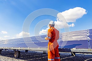 The solar farmsolar panel with engineers walk to check the operation of the system, Alternative energy to conserve the world`s