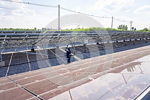 The solar farmsolar panel with engineers walk to check the operation of the system, Alternative energy to conserve the world`s