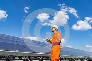 The solar farmsolar panel with engineers walk to check the operation of the system, Alternative energy to conserve the world`s