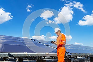 The solar farmsolar panel with engineers walk to check the operation of the system, Alternative energy to conserve the world`s