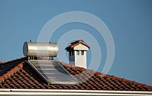 solar heater on the house roof in sunny cold winter day