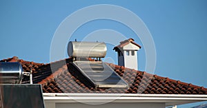 solar heater on the house roof in sunny cold winter day