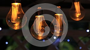 Solar lamps shining in the evening in the garden gazebo photo