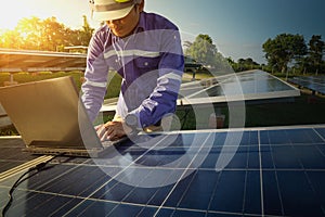 Solar panel, alternative electricity source, engineers are using the computer to check the operation of the system, Photovoltaic