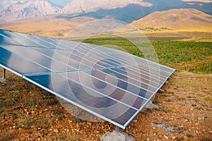 Solar panel on the background of mountains. sustainable development of new energy in agriculture