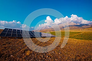 Solar panel on the background of mountains. sustainable development of new energy in agriculture