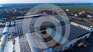 Solar panel cells on the industrial roof. Producing green electicity sunlight energy.