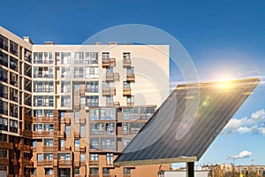 Solar panel on condn building and blue sky background
