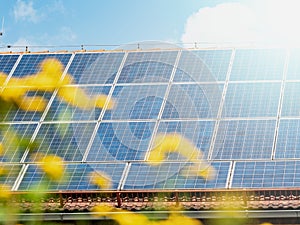 Solar panel on a family house red roof reflecting the sun and the sky