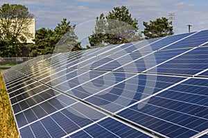 Solar Panel Farm. Corn Fields are Being Converted into Green Energy Areas Using Photovoltaic Cells I