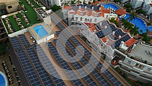 solar panel farming on roof of hotel, resort, house or residential building