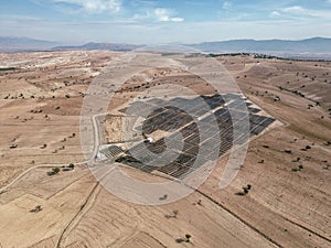 Solar panel field built on arid lands. Alternative green energy concept