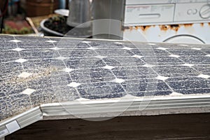 Solar panel in great state of degradation. Unused and discarded objects, old scrap.