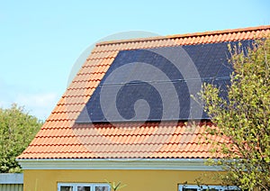 Solar panel on House Roof with Red Tiles