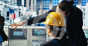 Solar panel plant manager showing engineer how to develop prototypes