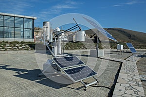 Solar panel, photovoltaic, alternative electricity source - concept of sustainable resources . Modern biogas factory, using sugar