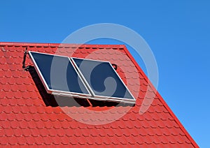 Solar panel on a red roof