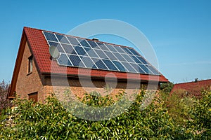 Solar panel on a red roof