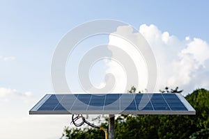 Solar panel with wind turbine