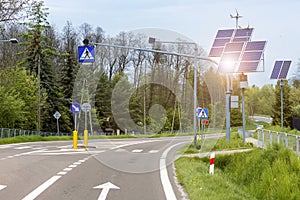 Solar Panel and Windmill Energy on Road with Traffic Light