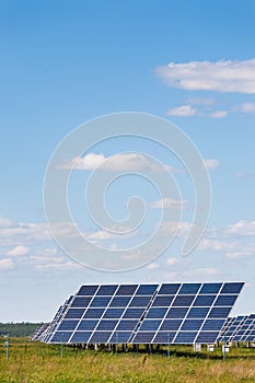 Solar panels against blue sky background