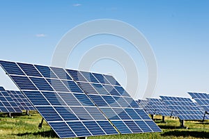 Solar panels against blue sky background