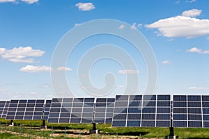 Solar panels against blue sky background