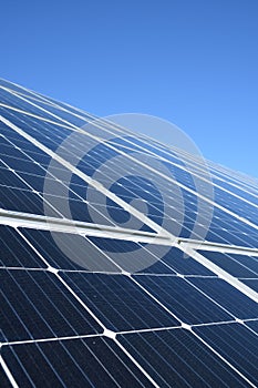 Solar panels against blue sky background.Against The Deep Blue Sky in suny weather