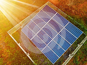 Solar panels against the sunshine, Bright Sunny Day, Solar Farm in rural, Eco-environmentally friendly green energy of sustainable