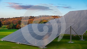Solar panels on the background of the autumn forest