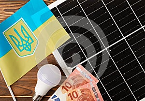 Solar panels on the background of the flag of Ukraine