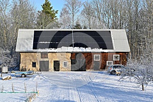 solar panels on barn roof a cold winter day