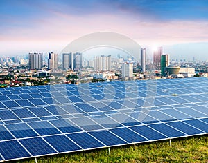 Solar panels, cityscape on background