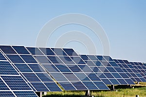 Solar panels against blue sky background