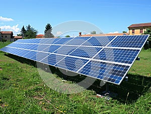 solar panels in field at photovoltaic power station, depicting green energy.