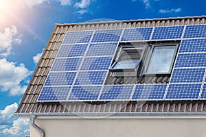 Solar panels for green energy on the tiled roof of suburban house, Photovoltaic module and regenerative energy system