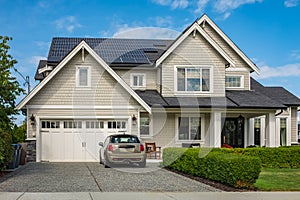 Solar panels on a house roof. Beautiful, large modern house and solar energy. Solar system on a roof Own home