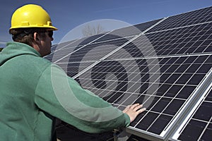 Solar panels inspected by workman photo