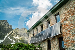 Solar panels installed on mountain house walls in High Tatras, Slovakia