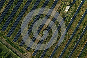 Solar panels installed outdoors, aerial top view. Alternative energy source