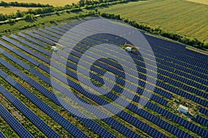 Solar panels installed outdoors, aerial view. Alternative energy source