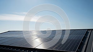 Solar panels installed on rooftop under clear blue sky