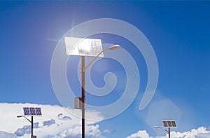 Solar panels on lamp posts reflecting sunlight renewable energy with blue sky