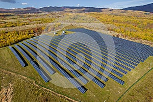 Solar panels near the forest. Ecology concept with solar panels. photo