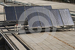 Solar panels over a building roof in Chamartin railway station.
