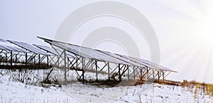 Solar panels Photocells on a gloomy foggy frosty winter day in the countryside.