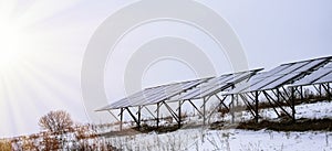 Solar panels Photocells on a gloomy foggy frosty winter day in the countryside.